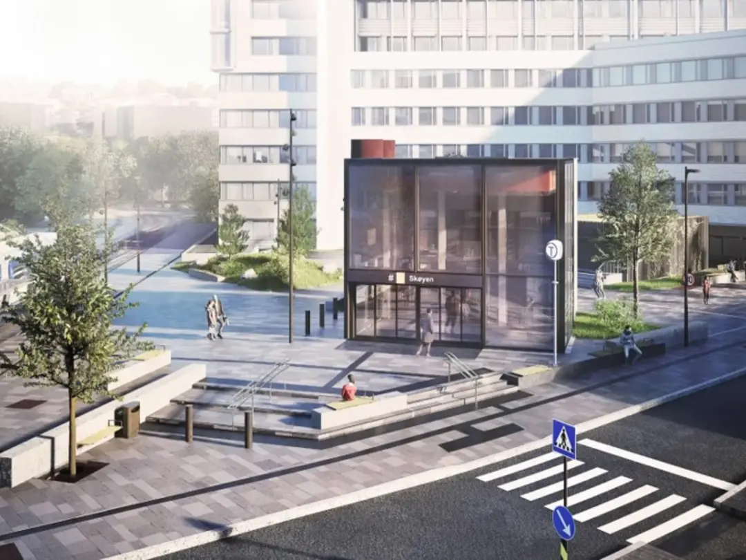 Moderne byområde med kontorbygninger, gågate og grøntområder.